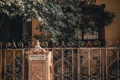 brown-mailbox-on-brown-metal-gate-2102584-scaled